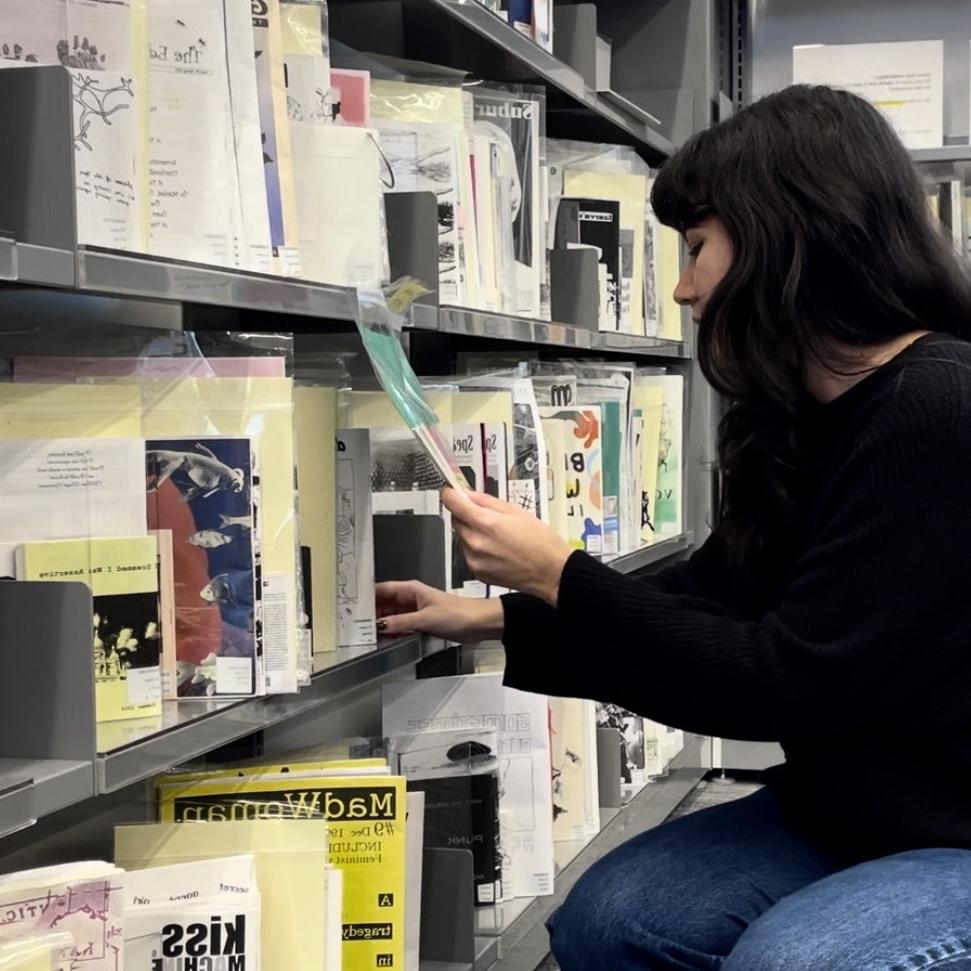 Nayla Delgado '24 in zines library 